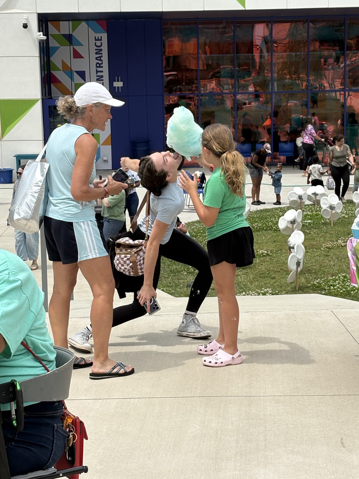 Family enjoying cotton candy at community event